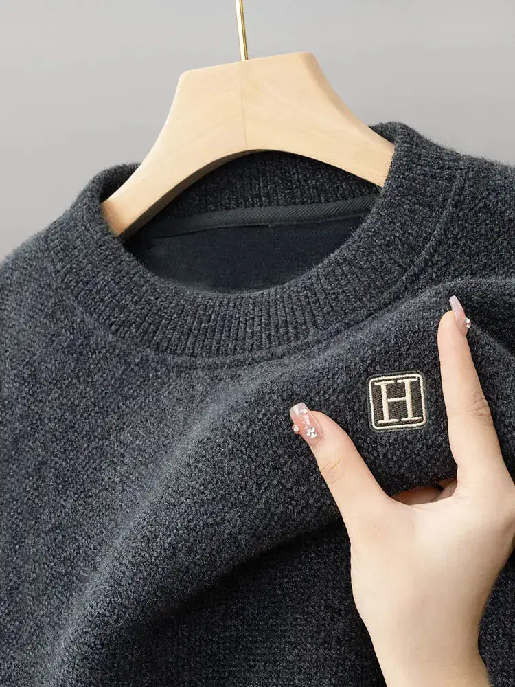 Soft snuggle fleece embroidered O-neck sweater, providing warmth and comfort for winter.