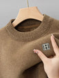 Soft snuggle fleece embroidered O-neck sweater, providing warmth and comfort for winter.